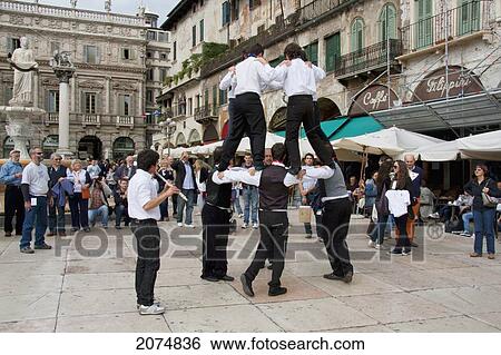 Boys Performing A Traditional Dance On The Piazza Delle Erbe, Verona, Italy View Large Photo Image Stock Photograph - Boys Performing A Traditional Dance On The Piazza Delle Erbe, Verona, Italy. Fotosearch