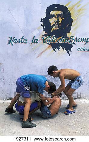 Boys Playing Beneath Wall Image Of Che Guevera View Large Photo Image Stock Image - Boys Playing Beneath Wall Image Of Che Guevera. Fotosearch