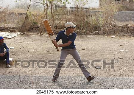 Boys Playing Cricket, Gwalior, Madhya Pradesh, India View Large Photo Image Stock Photography - Boys Playing Cricket, Gwalior, Madhya Pradesh, India. Fotosearch