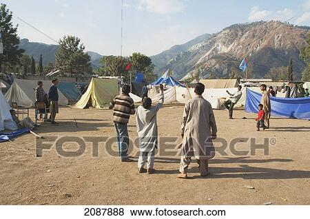 Boys Playing Football In A Relief Camp After The 8 October 2005 Earthquake, Muzaffarabad, Azad Kashmir, Pakistan View Large Photo Image Stock Photo - Boys Playing Football In A Relief Camp After The 8 October 2005 Earthquake, Muzaffarabad, Azad Kashmir, Pakistan. Fotosearch