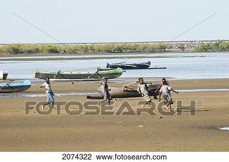 Boys Playing Football On The Beach In Mahavatse, Toliara Province, Madagascar View Large Photo Image Stock Image - Boys Playing Football On The Beach In Mahavatse, Toliara Province, Madagascar. Fotosearch