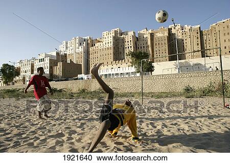Boys Playing Football, Walls Of Shibam View Large Photo Image Stock Image - Boys Playing Football, Walls Of Shibam. Fotosearch