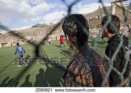 Stock Image - Boys Playing On The Football Pitch Close To The Iran Border In Iraqi Kurdistan, Iraq. Fotosearch