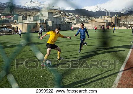 Boys Playing On The Football Pitch Close To The Iran Border In Iraqi Kurdistan, Iraq View Large Photo Image Stock Image - Boys Playing On The Football Pitch Close To The Iran Border In Iraqi Kurdistan, Iraq. Fotosearch
