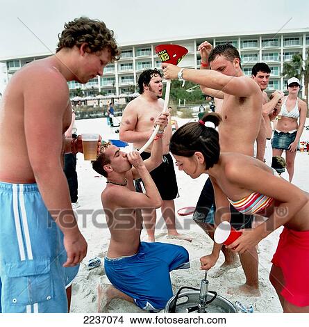 Boys (Students) Drinking Beer Through A Funnel On The Beach, Spring Break, Panama City, Florida, Usa. View Large Photo Image Picture - Boys (Students) Drinking Beer Through A Funnel On The Beach, Spring Break, Panama City, Florida, Usa.. Fotosearch