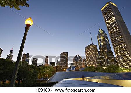 Bp Amoco Bridge, With City Skyline In Background At Dusk, Low Angle View View Large Photo Image Stock Photo - Bp Amoco Bridge, With City Skyline In Background At Dusk, Low Angle View. Fotosearch