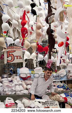 Stock Image - Bra and underwear stall vendor at Carsamba Pazari, the Wednesday Market in Fatih is one of Istanbul's oldest and most colourful market places, which is located around a network of streets surrounding the Fatih Mosque in Istanbul, Turkey. Photo. Fotosearch