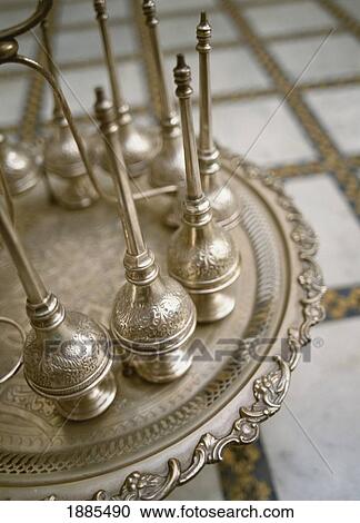Stock Image - Brass Pipes On Ornate Table, Close Up. Fotosearch