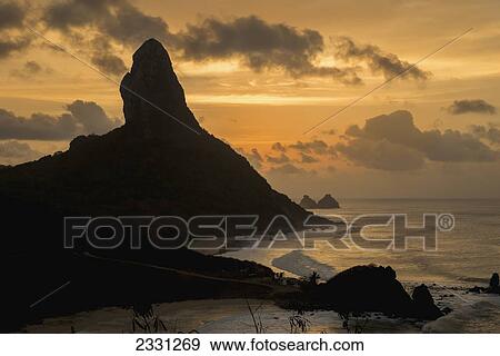 Brazil, Pernambuco, View of Morro do Pico at sunset from Forte dos Remedios; Fernando de Noronha View Large Photo Image Stock Photo - Brazil, Pernambuco, View of Morro do Pico at sunset from Forte dos Remedios; Fernando de Noronha. Fotosearch