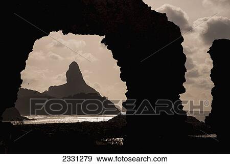 Stock Photo - Brazil, Pernambuco, Views of Morro do Pico from ruins of Forte de Santo Antonio; Fernando de Noronha. Fotosearch