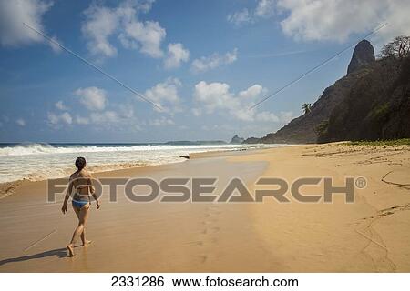 Brazil, Pernambuco, Young woman enjoying view of Morro do Pico from Praia do Boldro; Fernando de Noronha View Large Photo Image Stock Photograph - Brazil, Pernambuco, Young woman enjoying view of Morro do Pico from Praia do Boldro; Fernando de Noronha. Fotosearch
