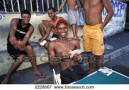 Brazil, Salvador, Men Playing Cards And Laughing; Calfate Favela View Large Photo Image Stock Photo - Brazil, Salvador, Men Playing Cards And Laughing; Calfate Favela. Fotosearch