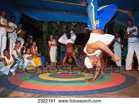 Stock Image - Brazilian martial arts/dance practice of Capoeira; Itacare, Bahia, Brazil. Fotosearch