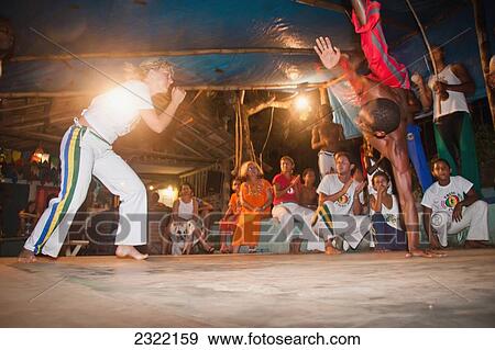 Stock Photo - Brazilian martial arts/dance practice of Capoeira; Itacare, Bahia, Brazil. Fotosearch