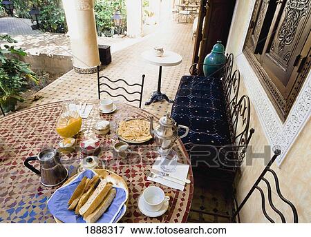 Stock Photo - Breakfast At Riad Al Arsat Hotel Porch. Fotosearch