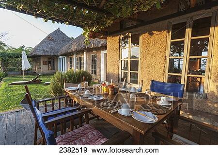 Breakfast table at the Ndali Lodge; Uganda View Large Photo Image Stock Photo - Breakfast table at the Ndali Lodge; Uganda. Fotosearch