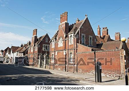 Stock Photo - Brick Buildings With Chimneys Along A Street; Salisbury England. Fotosearch