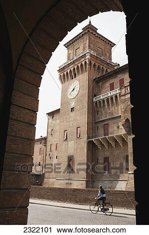 Brick castle tower and male cyclist framed in archway; Ferrara, Emilia-Romagna, Italy View Large Photo Image Stock Image - Brick castle tower and male cyclist framed in archway; Ferrara, Emilia-Romagna, Italy. Fotosearch