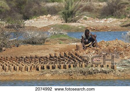Brick Makers, Antsokay, Toliara Province, Madagascar View Large Photo Image Stock Image - Brick Makers, Antsokay, Toliara Province, Madagascar. Fotosearch
