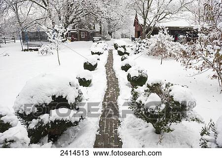 Stock Image - Brick pathway at snow covered farm; Fallston, Maryland, United States of America. Fotosearch