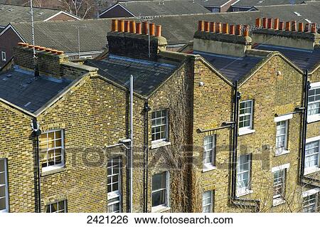 Brick residential buildings with chimneys, Shoreditch; London, England View Large Photo Image Stock Photograph - Brick residential buildings with chimneys, Shoreditch; London, England. Fotosearch
