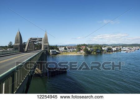 Stock Photography - Bridge across the water to Florence; Florence, Oregon, United States of America. Fotosearch