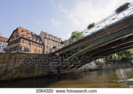 Bridge And Alsatian Houses On The Dock Boatmen By The Ill River, Strasbourg, France View Large Photo Image Stock Image - Bridge And Alsatian Houses On The Dock Boatmen By The Ill River, Strasbourg, France. Fotosearch