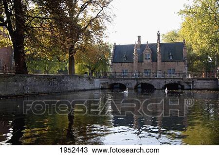 Stock Image - Bridge over a canal by the Sashuis (Sluice House), Bruges (Brugge), West Flanders, Belgium. Fotosearch