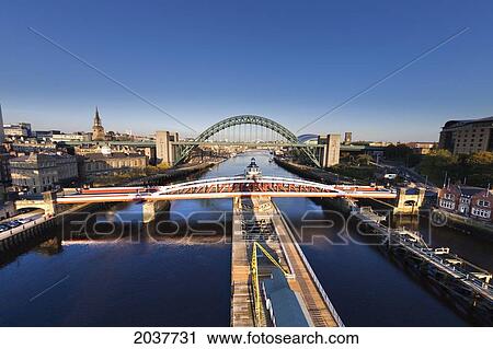 Stock Image - Bridges Crossing River Tyne; Newcastle Tyne And Wear England. Fotosearch