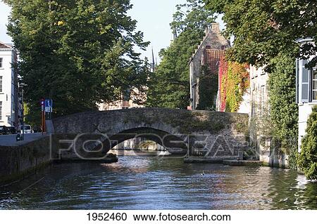 Bridges over a canal, Bruges (Brugge), West Flanders, Belgium View Large Photo Image Stock Image - Bridges over a canal, Bruges (Brugge), West Flanders, Belgium. Fotosearch