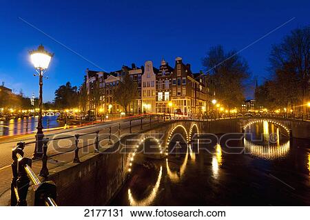 Bridges Over Canals At Dusk, Amsterdam, Holland. View Large Photo Image Stock Image - Bridges Over Canals At Dusk, Amsterdam, Holland.. Fotosearch