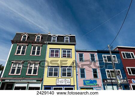 Stock Image - Bright coloured buildings in a row; St. John's, Newfoundland, Canada. Fotosearch