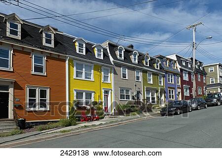 Bright coloured houses in a row; St. John's, Newfoundland, Canada View Large Photo Image Stock Photo - Bright coloured houses in a row; St. John's, Newfoundland, Canada. Fotosearch