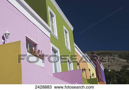 Stock Image - Bright, multi-hued houses on Wale Street; Cape Town, South Africa. Fotosearch