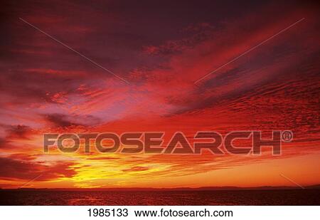 Bright Orange Sunset Over Ocean. View Large Photo Image Stock Image - Bright Orange Sunset Over Ocean.. Fotosearch