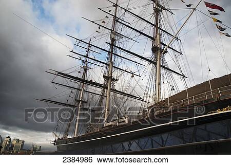 Stock Photograph - British clipper ship with the city of London in the background; London, England. Fotosearch