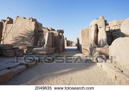 Stock Photography - Broken Colossi Of Tuthmosis Iii At The Seventh Pylon, East Wing, Southern Facade In The Karnak Temple Complex, Luxor, Qina, Egypt. Fotosearch