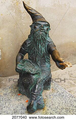 Bronze Sculpture Of A Gnome Beside A Cash Point; Wroclaw Poland View Large Photo Image Stock Image - Bronze Sculpture Of A Gnome Beside A Cash Point; Wroclaw Poland. Fotosearch