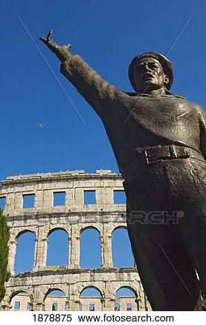 Bronze Statue In Front Of Roman Amphitheater. View Large Photo Image Stock Photography - Bronze Statue In Front Of Roman Amphitheater.. Fotosearch