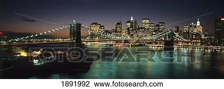 Stock Image - Brooklyn Bridge And Lower Manhattan At Dusk From Manhattan Bridge. Fotosearch