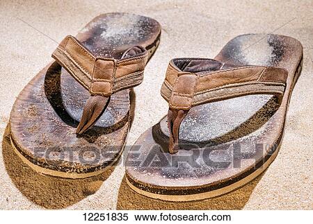 Brown leather sandals on the sand; Spain View Large Photo Image Stock Photography - Brown leather sandals on the sand; Spain. Fotosearch