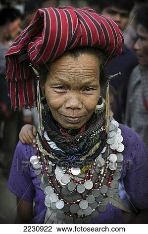 Bru Tribe / Tribal Elder Woman Wearing Traditional Bead And Indian Rupee Coin Jewelry, Naisingpara Refugee Camp, Tripura, North East States, India Pic: Copyright Timothy Allen / Axiom View Large Photo Image Stock Image - Bru Tribe / Tribal Elder Woman Wearing Traditional Bead And Indian Rupee Coin Jewelry, Naisingpara Refugee Camp, Tripura, North East States, India Pic: Copyright Timothy Allen / Axiom. Fotosearch