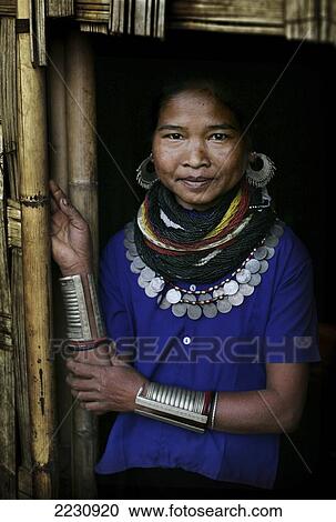 Stock Image - Bru Tribe / Tribal Woman Wearing Traditional Beads And Coin Jewelry, Also Known As Reang Tribe, Damdiai Village, Jampui Hills, On Mizoram Border, Tripura, North East States, India Pic: Copyright Timothy Allen / Axiom. Fotosearch