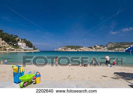 Stock Image - Buckets and spades on wall in front of beach of Puerto de Soller; Majorca, Spain. Fotosearch