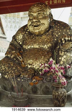 Stock Photo - Buddha Covered In Gold Leaf At Wat Po. Fotosearch