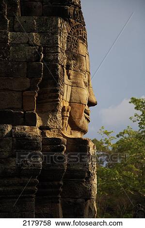 Buddha face at Bayon temple area Siem Reap Cambodia View Large Photo Image Stock Photo - Buddha face at Bayon temple area Siem Reap Cambodia. Fotosearch