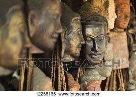 Buddha faces in the old market; Siem Reap, Cambodia View Large Photo Image Stock Photography - Buddha faces in the old market; Siem Reap, Cambodia. Fotosearch