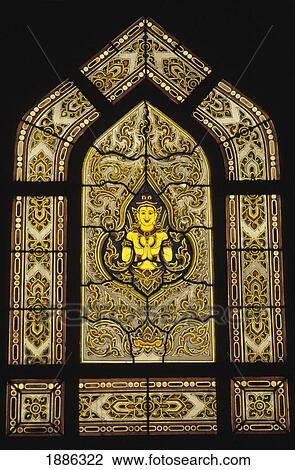 Stock Image - Buddha In Stained Glass At Wat Benjamabophit. Fotosearch