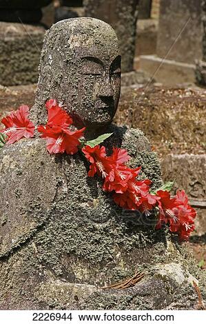 Picture - Buddha Statue At A Traditional Japanese Cemetery, Japan - Copyright Mark Thomas/Axiom. Fotosearch