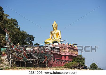 Buddha statue on a boat; Chiang Saen, Chiang Rai, Thailand View Large Photo Image Stock Photograph - Buddha statue on a boat; Chiang Saen, Chiang Rai, Thailand. Fotosearch